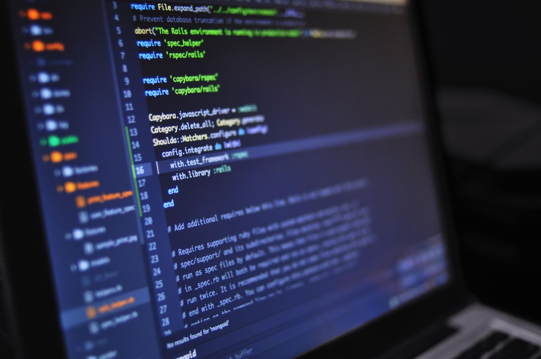 Developer reviewing website audit showing SEO and accessibility issues on a laptop