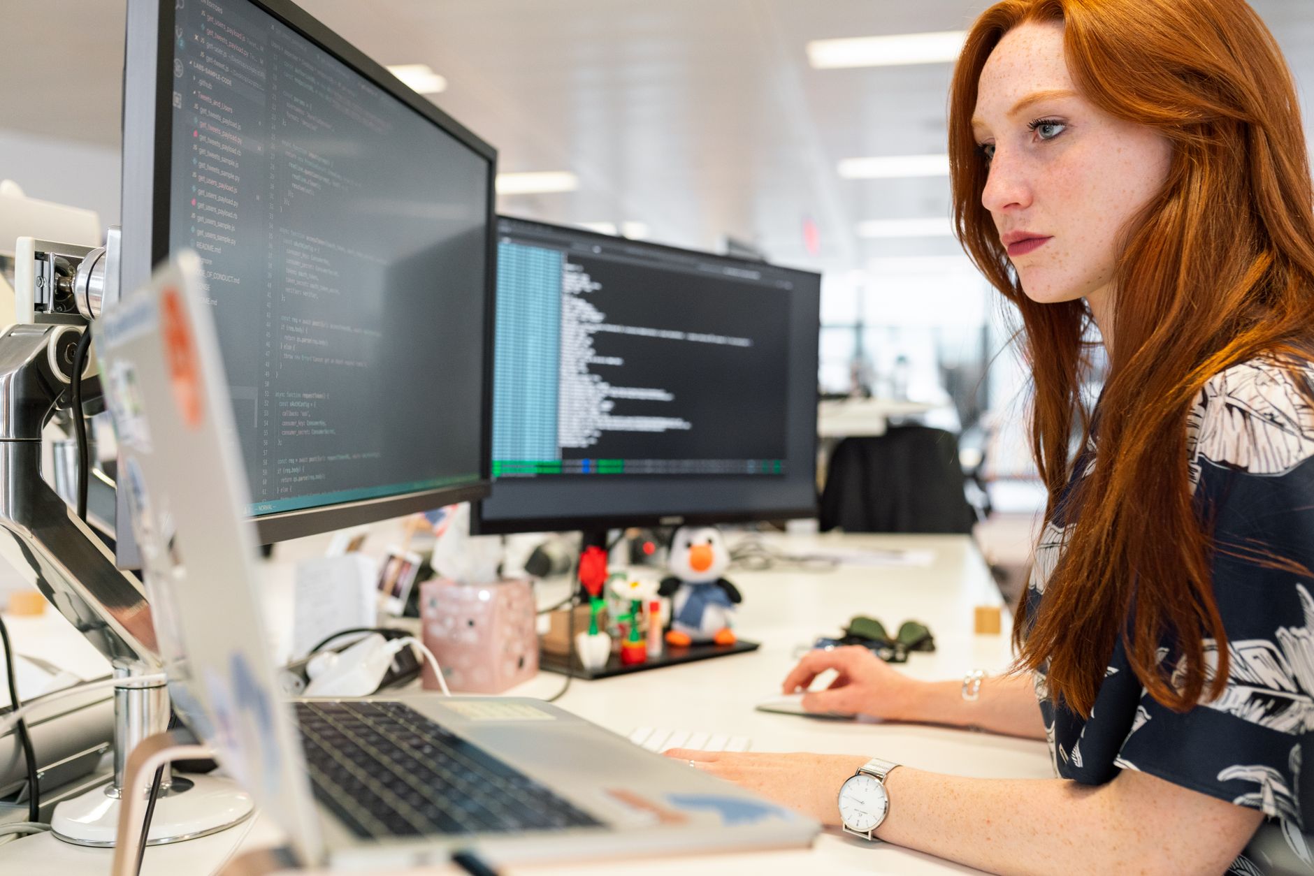 Developer reviewing website audit showing SEO and accessibility issues on a laptop