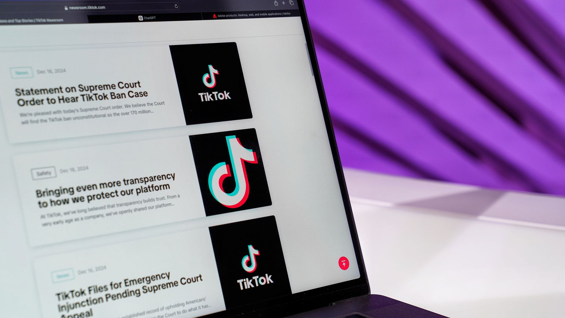 Person reviewing a website compliance dashboard with cookie consent and accessibility checks on screen