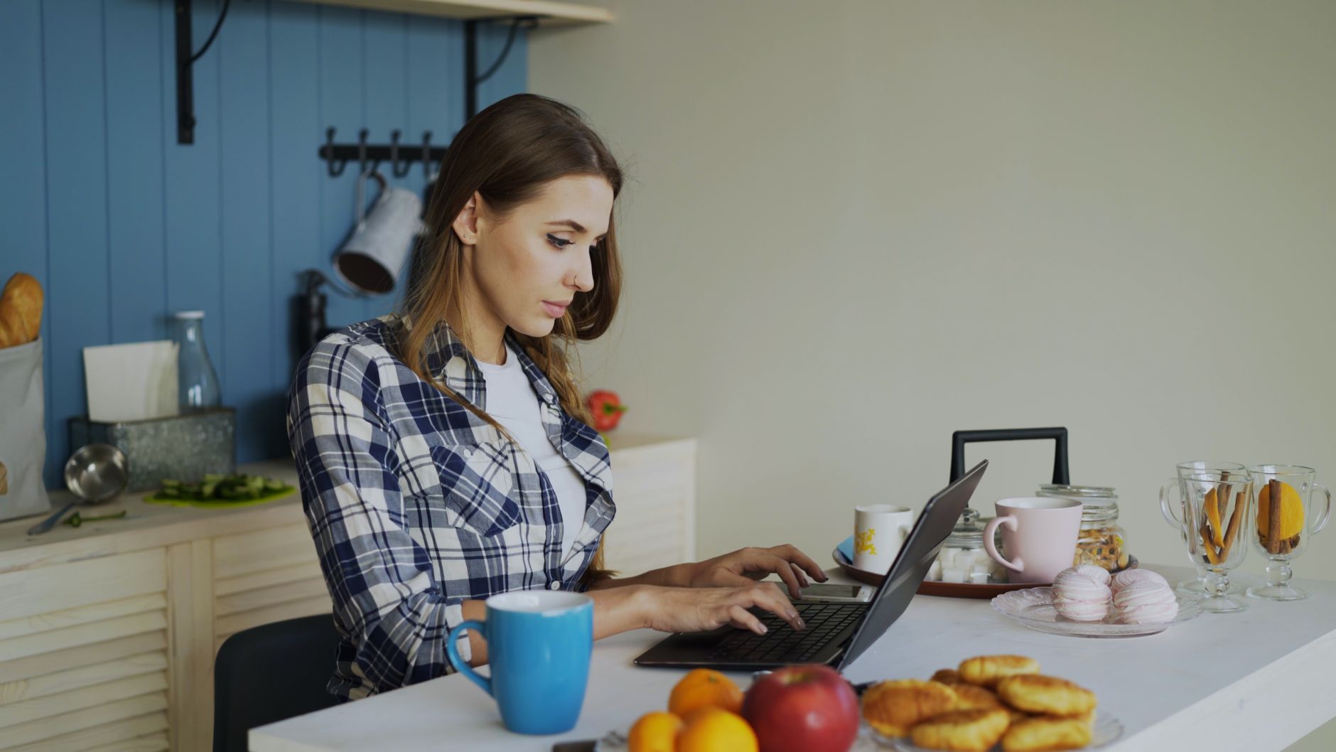 Person reviewing a cookie consent banner and compliance checklist on a laptop
