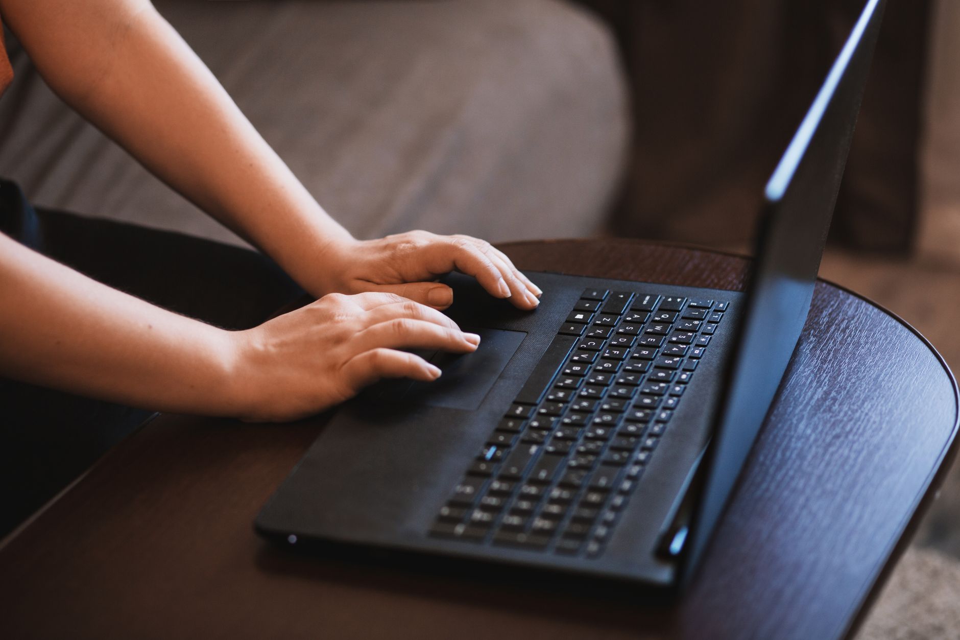Person using a laptop with accessibility settings open, representing inclusive web access in Turkey