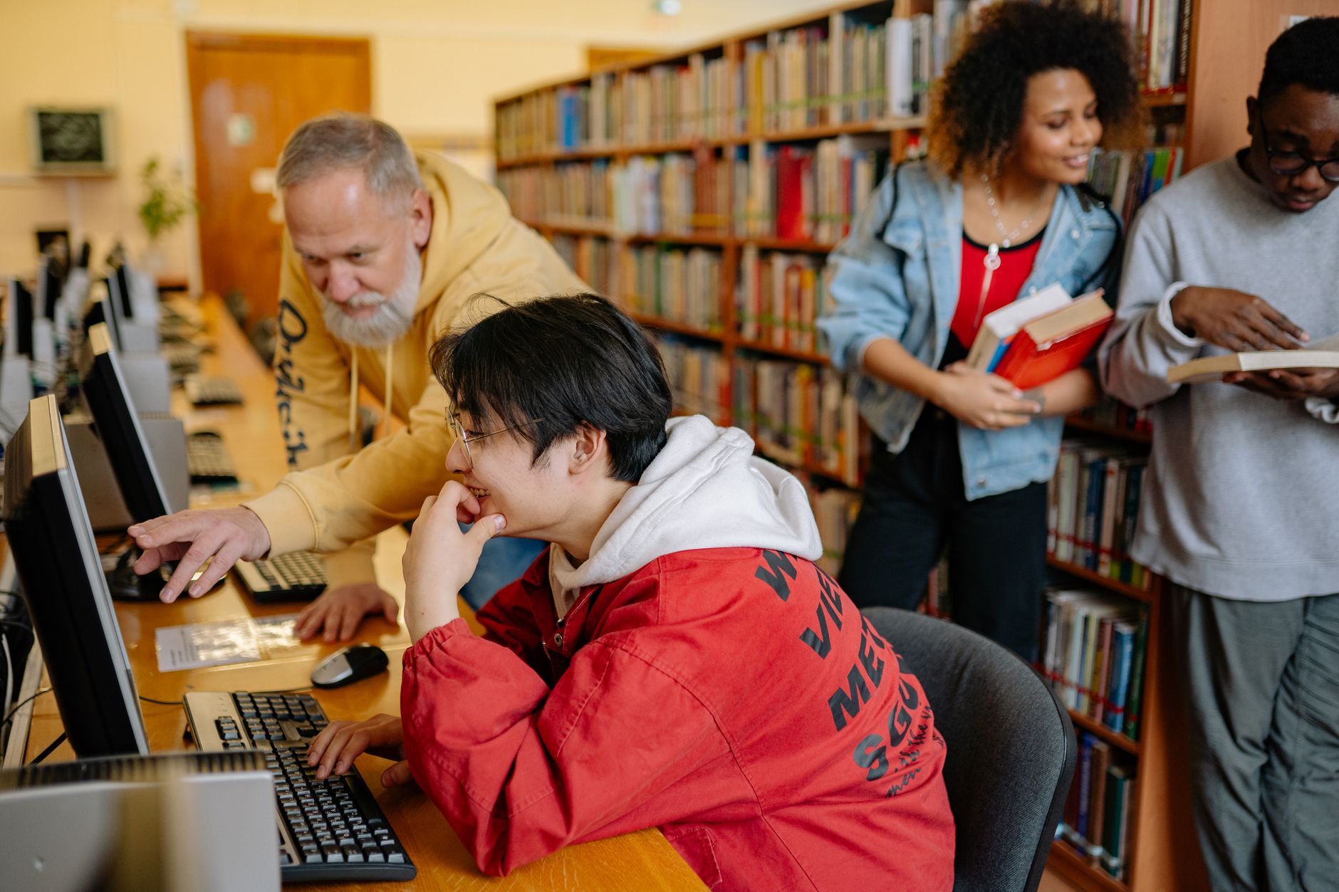 University web team reviewing accessibility issues on a laptop with a checklist