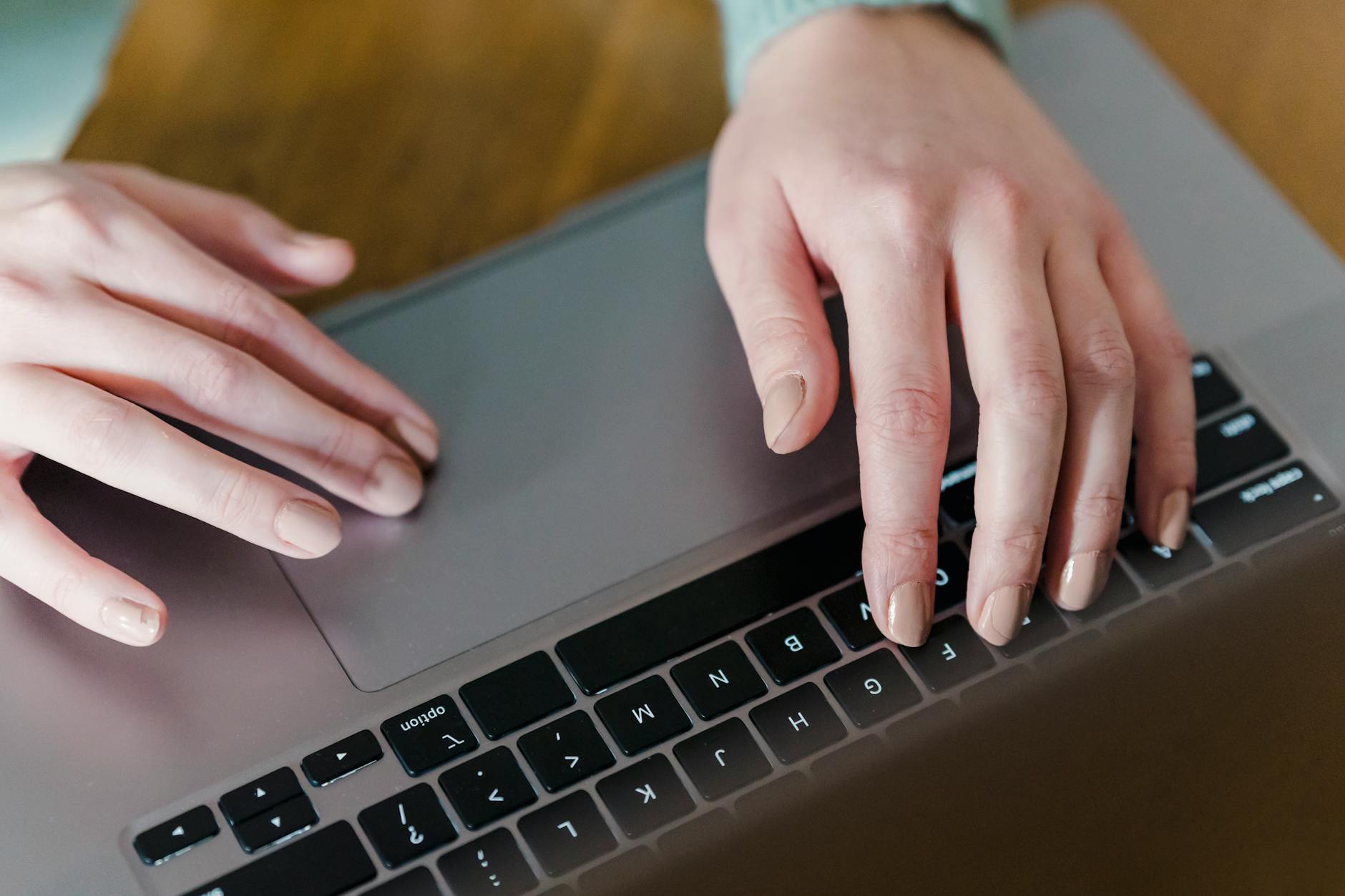 Developer reviewing AI-generated website code with accessibility checklist on a second monitor