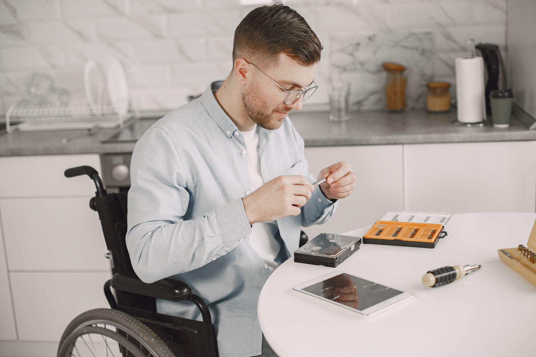 SaaS team reviewing a VPAT accessibility document on a laptop in a meeting room