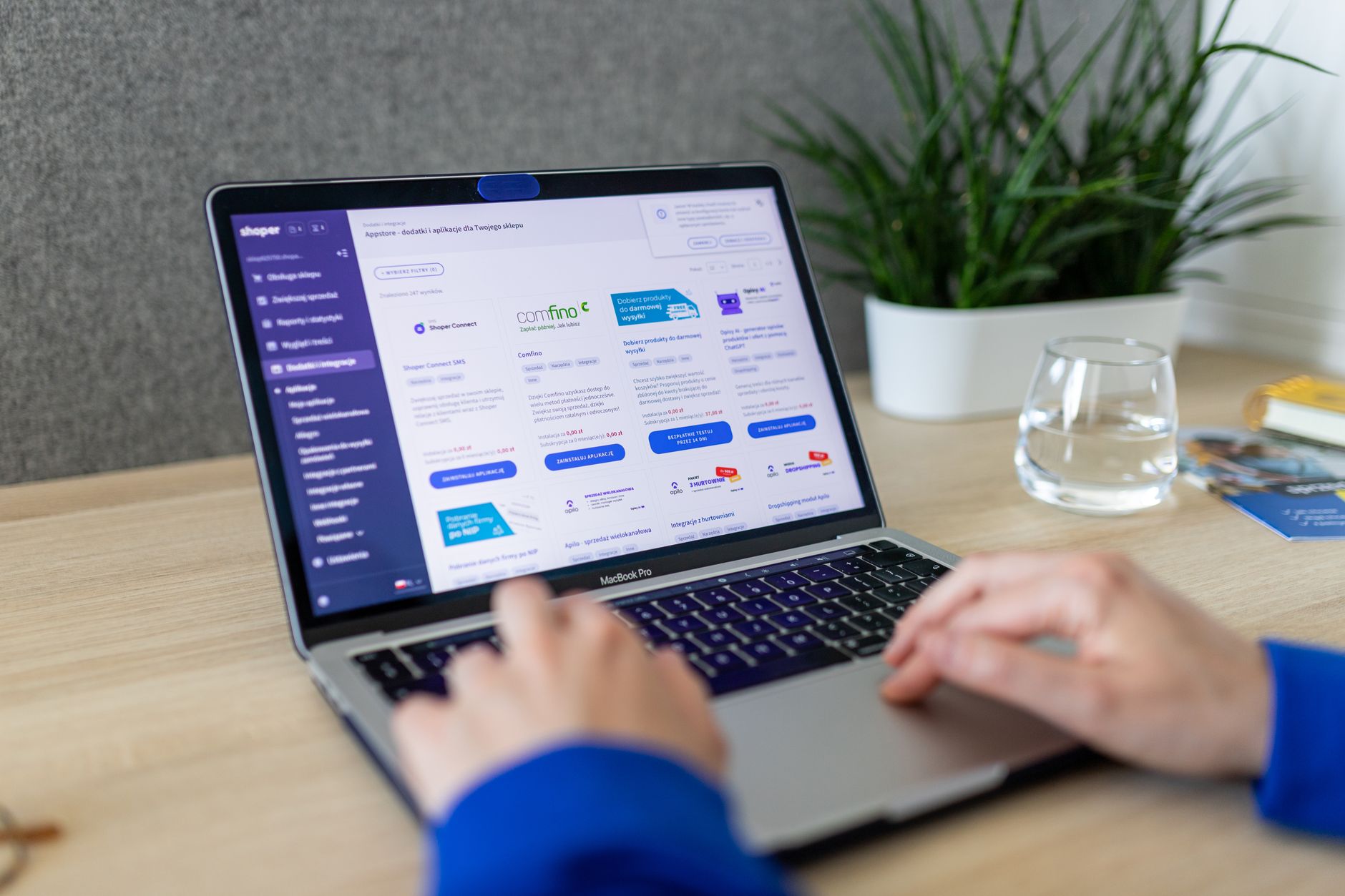 Designer reviewing website accessibility checklist on a laptop with contrast and heading notes