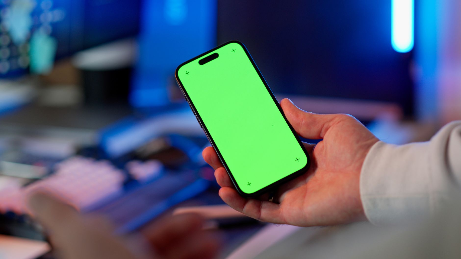 Mobile app accessibility checklist on a desk with a smartphone displaying accessibility settings
