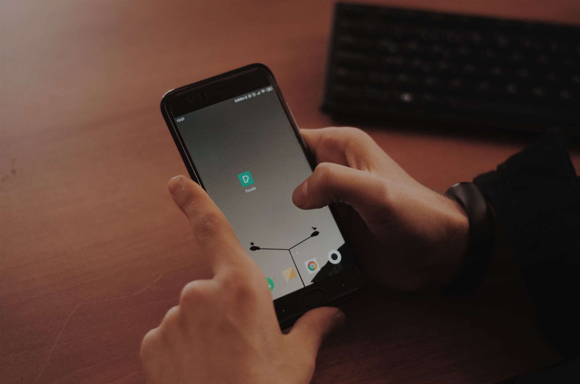 Person testing a smartphone app with a screen reader and accessibility settings enabled
