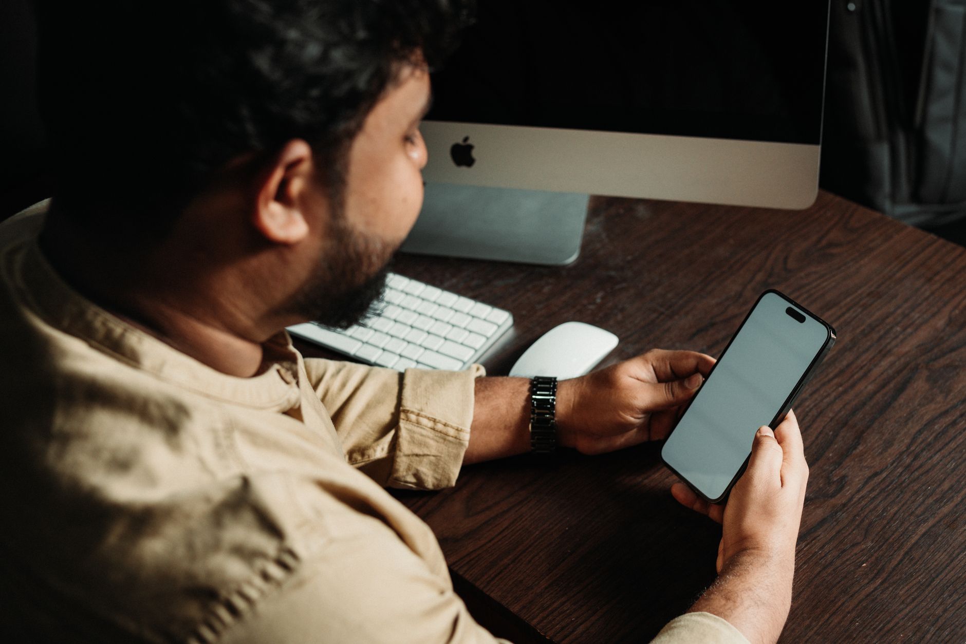 Person testing a smartphone app with a screen reader and accessibility settings enabled