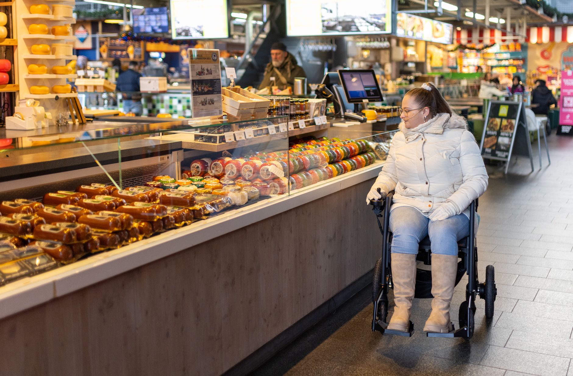 Person shopping online for groceries on a laptop with an accessibility settings panel open